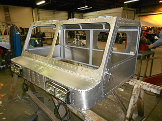 restoration of aluminum snow cat cab side view