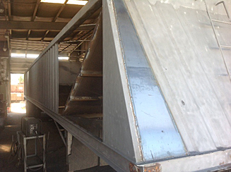 Rebuilt aluminum and steel hopper trailer front view